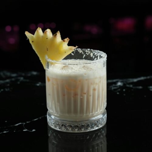 Pina Colada Cocktail Decorated with a Piece of Pineapple